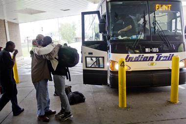 An Indian Trails passenger says goodbye before boarding a Chicago-bound Indian Trails bus from Flint at the bus station at 1407 South Dort Highway in Flint on Monday afternoon. Zack Wittman | MLive.com