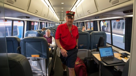 An Amtrak baggage handler walks through a train before departing from Union Station in Washington, Thursday, Sept. 3, 2015.